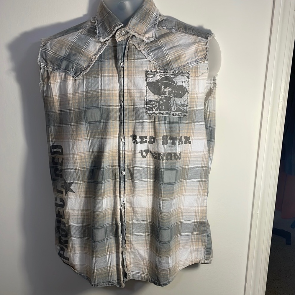 Sleeveless cutoff button down shirt. Brand new but has no tags.